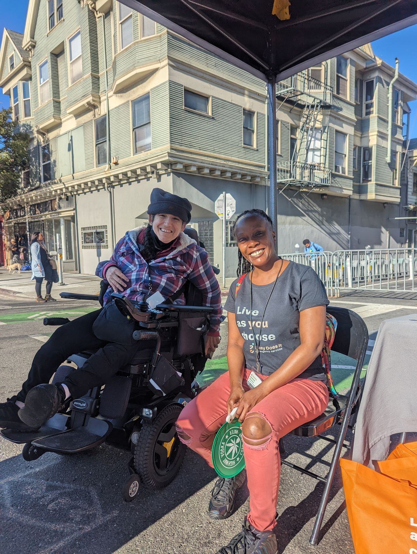 A Portrait of Marissa and Ayanna in the Outreach Booth at Oakland First Fridays/