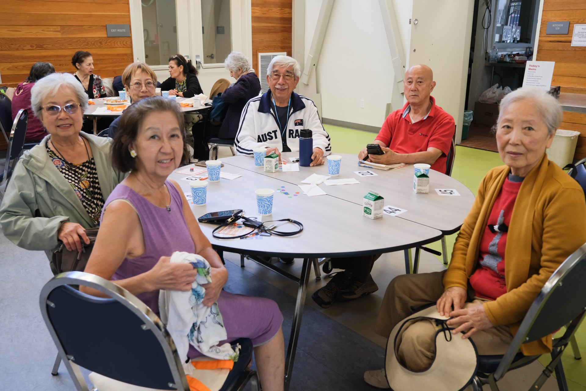 A group of people sitting around a table Description automatically generated