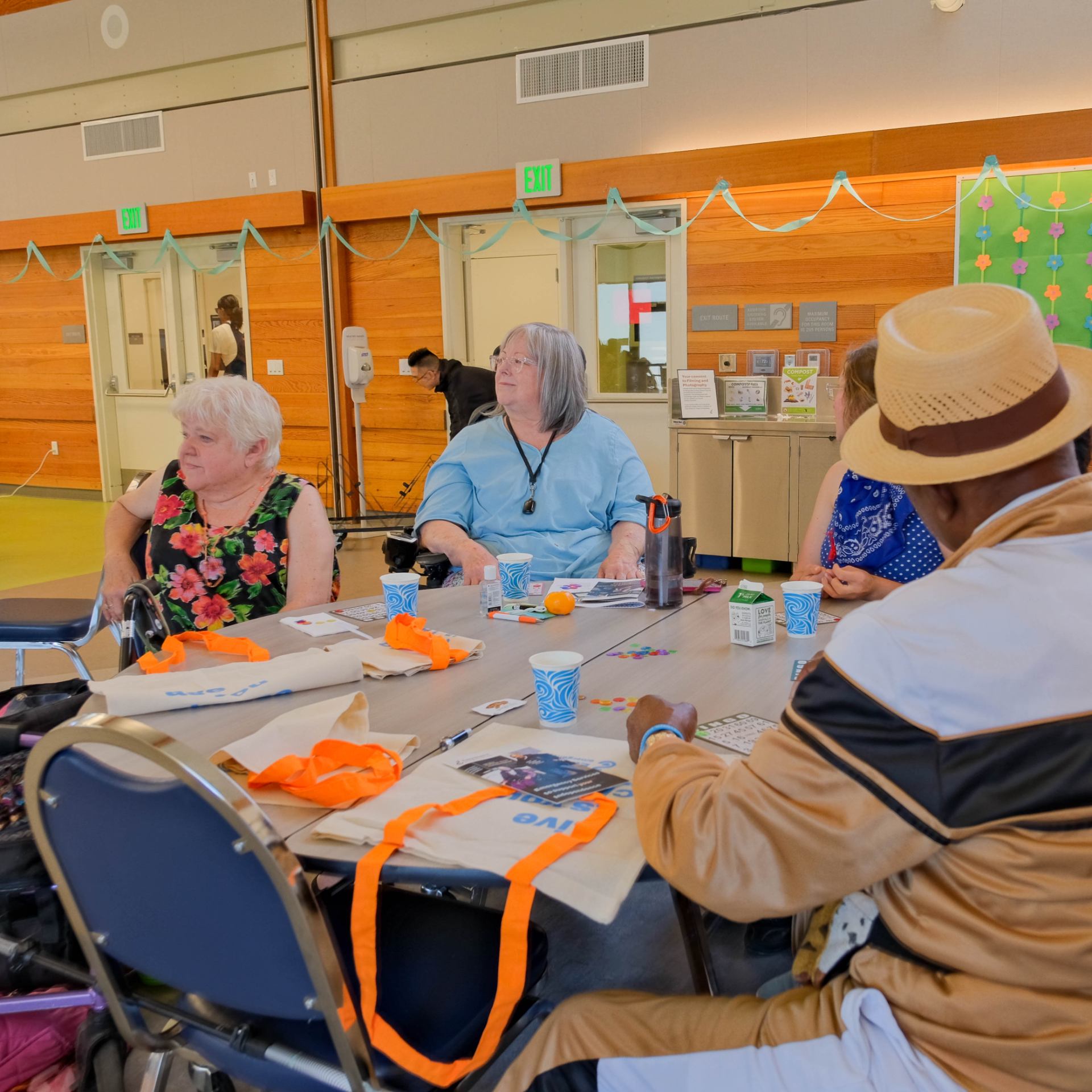 A group of people sitting at a table Description automatically generated